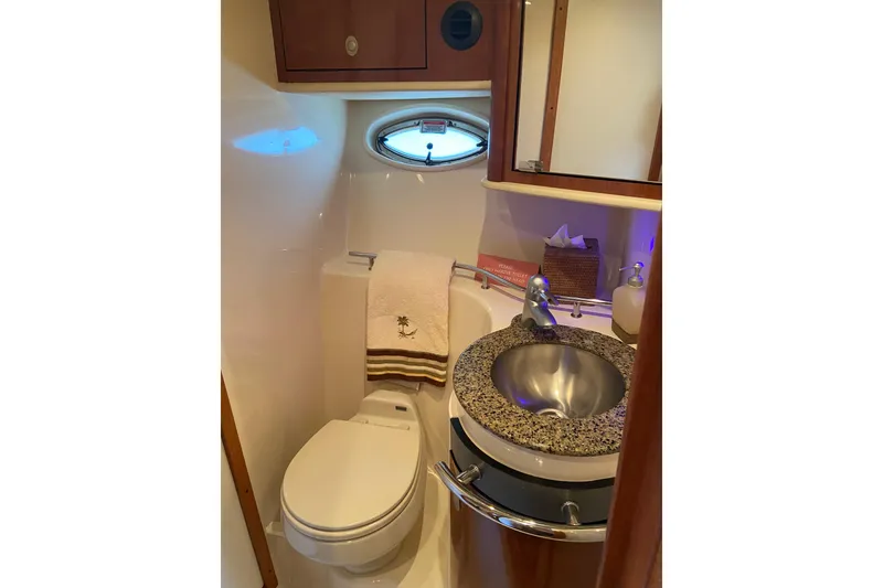 Slide: The Image of Luxurious bathroom in 2006 Sea Ray 40 Sundancer yacht with modern fixtures and porthole window. - 34