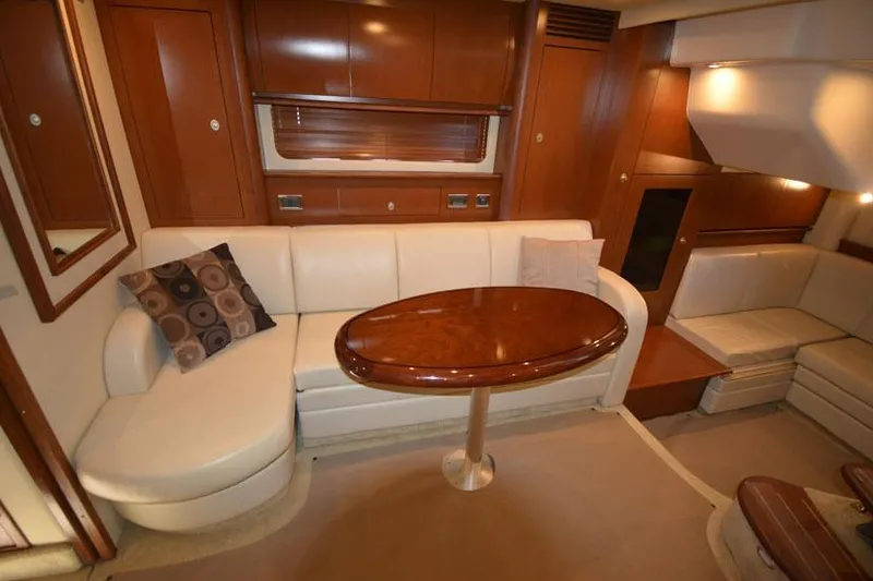 Slide: The Image of Luxurious interior of 2006 Sea Ray 40 Sundancer yacht with elegant seating and wooden table. - 35
