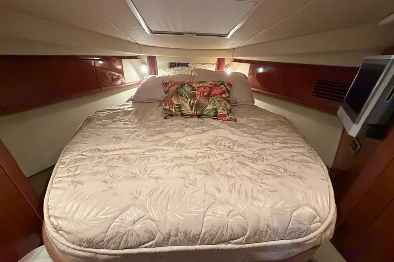 Slide: The Image of Luxurious cabin interior of 2006 Sea Ray 40 Sundancer yacht with cozy bed. - 36