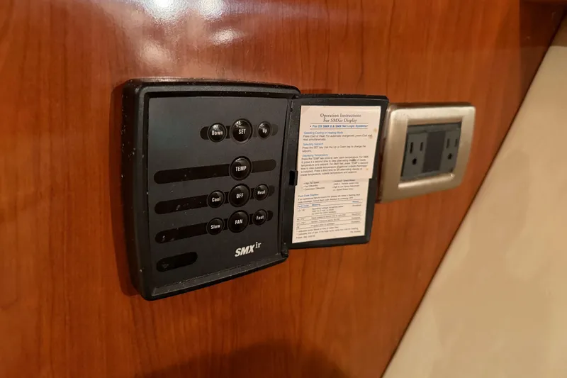 Slide: The Image of Control panel on 2006 Sea Ray 40 Sundancer yacht interior, featuring SMXir system. - 37