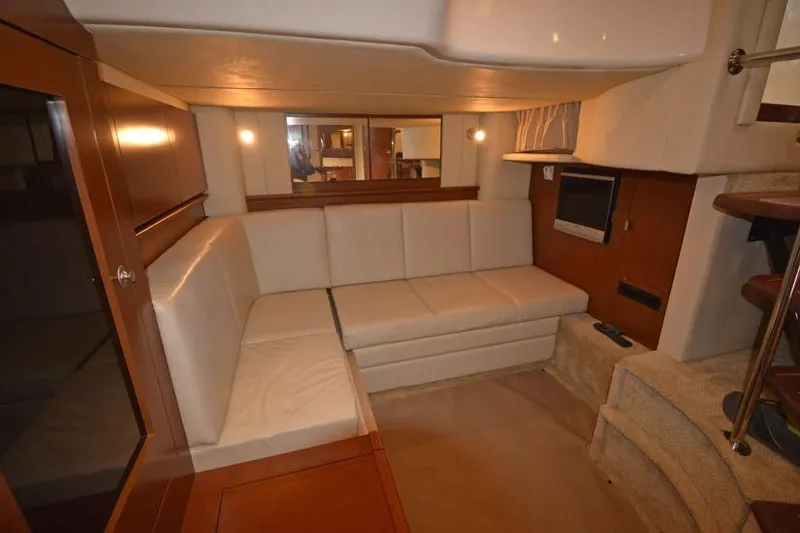 Slide: The Image of Interior of 2006 Sea Ray 40 Sundancer yacht with cozy seating and TV. - 42