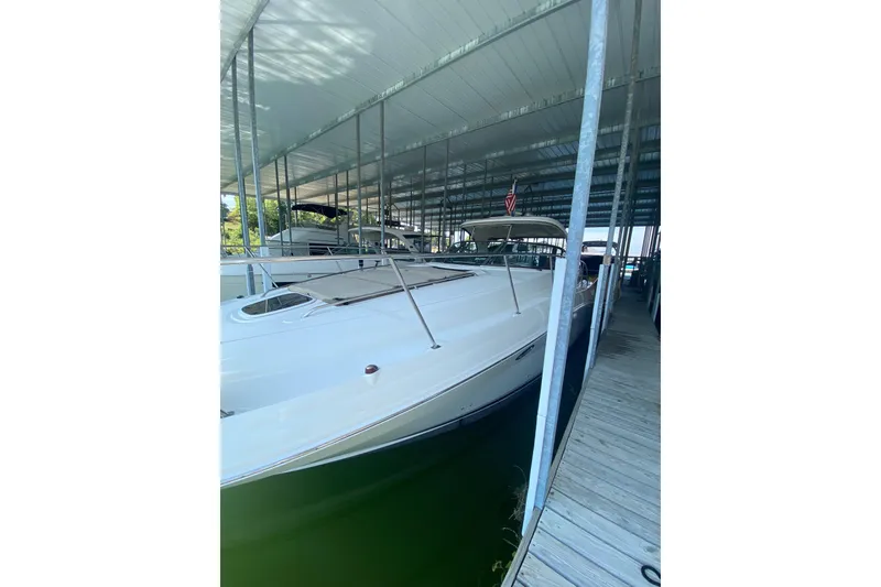 Slide: The Image of 2006 Sea Ray 40 Sundancer docked under covered marina. - 5