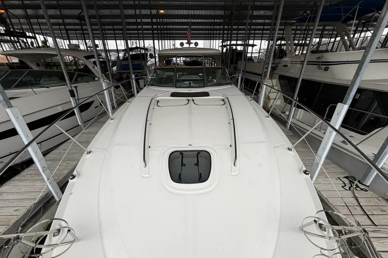 Slide: The Image of 2006 Sea Ray 40 Sundancer yacht docked in a covered marina. - 7