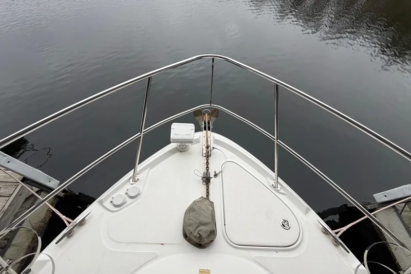 Slide: The Image of Bow view of 2006 Sea Ray 40 Sundancer yacht on calm water. - 8