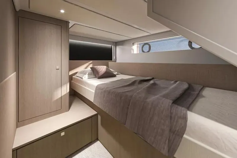 Slide: The Image of 2026 Beneteau Gran Turismo 50 cabin interior with modern design and cozy bedding. - 11