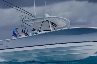 The Image of 2026 Regulator 30XO boat cruising on the ocean under cloudy skies. - 1