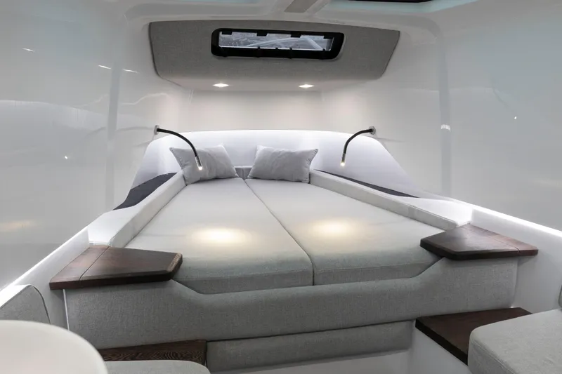 Slide: The Image of Luxurious interior of 2025 Axopar 37XC CROSS CABIN BRABUS Trim with modern bedding. - 5