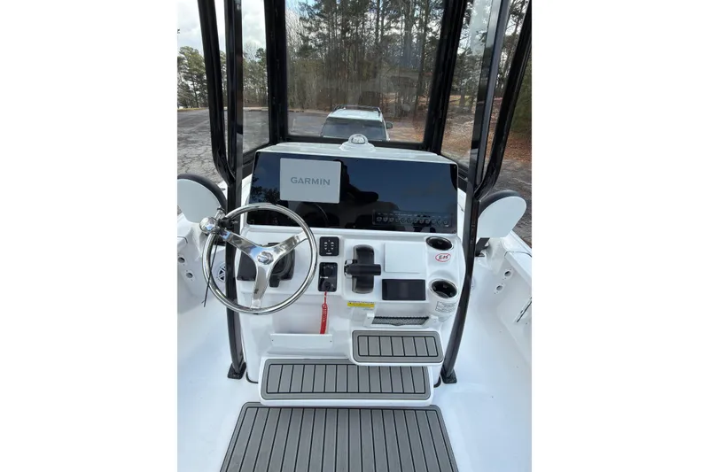 Slide: The Image of 2026 Tidewater 2210 Carolina Bay boat console with Garmin display and steering wheel. - 10