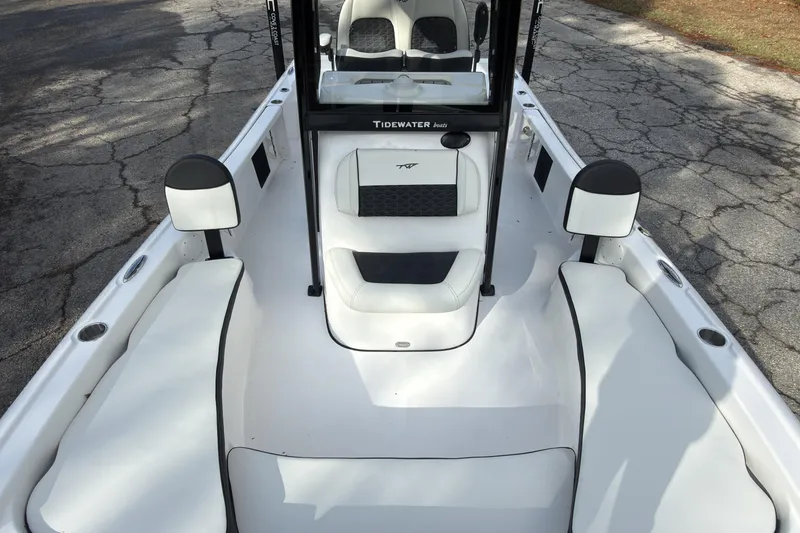 Slide: The Image of 2026 Tidewater 2210 Carolina Bay boat interior with white seating and console. - 16