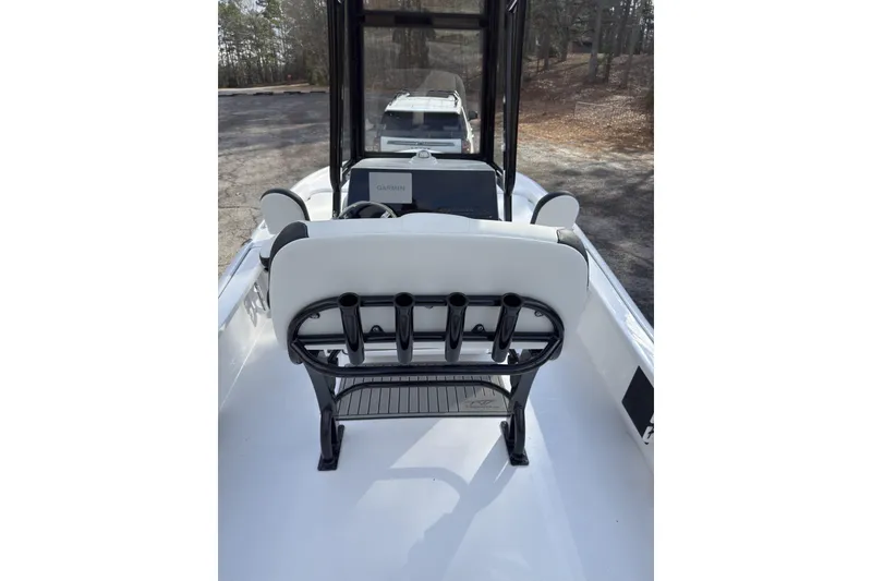 Slide: The Image of 2026 Tidewater 2210 Carolina Bay boat interior with seating and rod holders. - 8