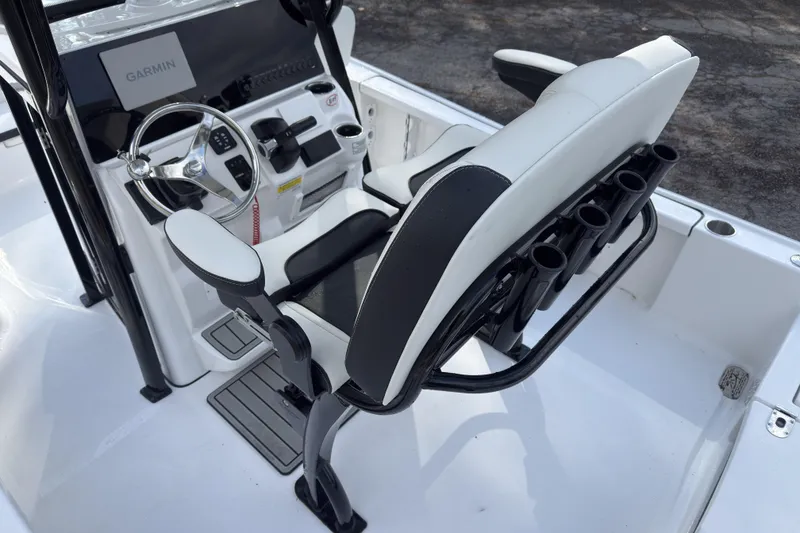 Slide: The Image of 2026 Tidewater 2210 Carolina Bay boat interior with steering wheel and seating. - 9