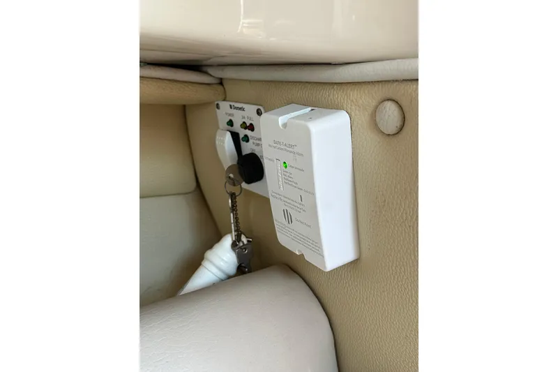 Slide: The Image of 2011 Robalo R245 Walkaround boat interior with control panel and key. - 15