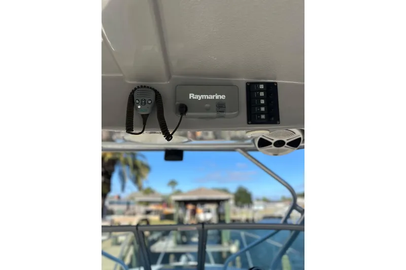 Slide: The Image of 2011 Robalo R245 Walkaround boat with Raymarine electronics and control panel. - 17