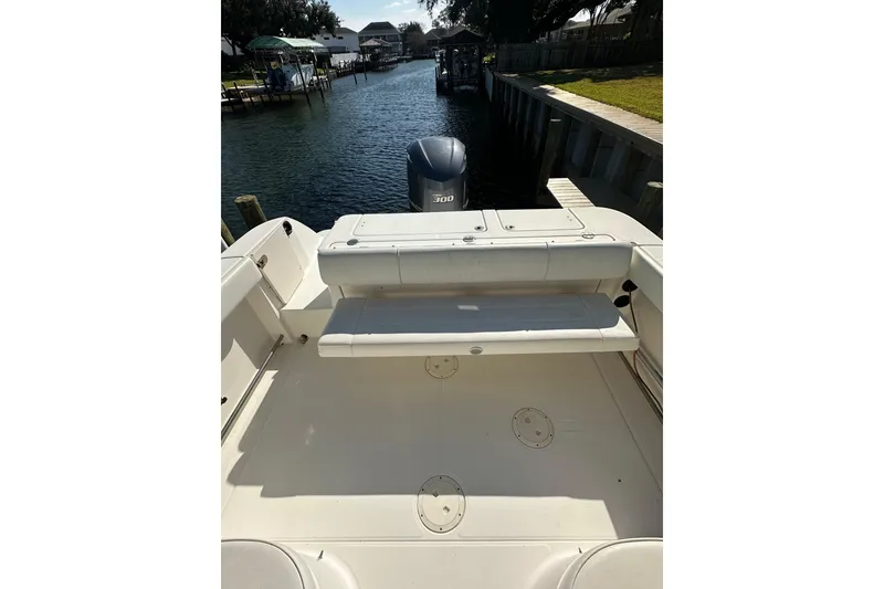 Slide: The Image of 2011 Robalo R245 Walkaround boat with spacious deck and outboard motor. - 5