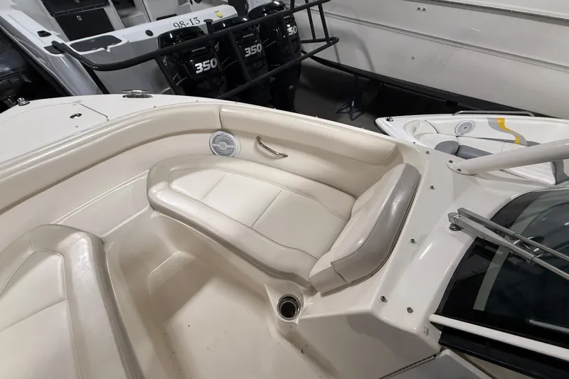 Slide: The Image of 2014 Pursuit DC 265 Dual Console interior with seating and console details. - 27
