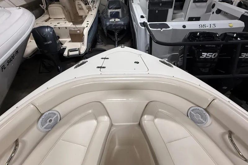 Slide: The Image of 2014 Pursuit DC 265 Dual Console boat interior with sink and steering console. - 28