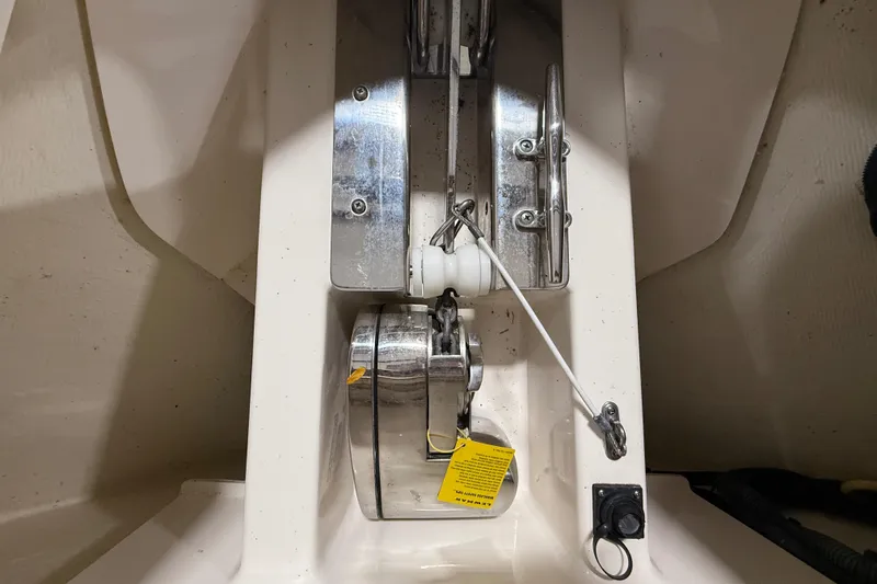 Slide: The Image of 2014 Pursuit DC 265 Dual Console boat sink with glass and blue towel. - 29