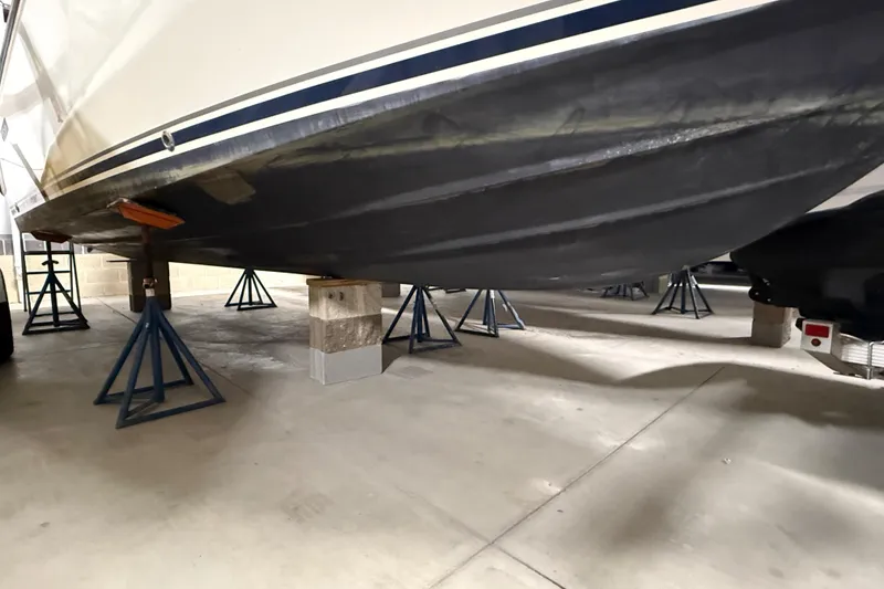 Slide: The Image of 2014 Pursuit DC 265 Dual Console boat interior with steering wheel and seating. - 32