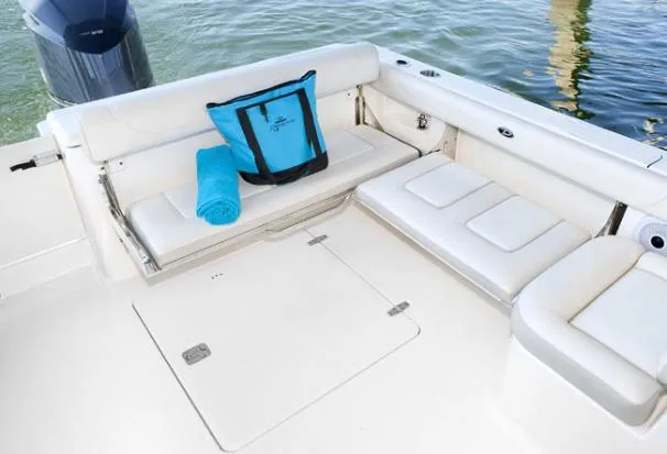 Slide: The Image of 2014 Pursuit DC 265 Dual Console boat bathroom with sink and toilet. - 38
