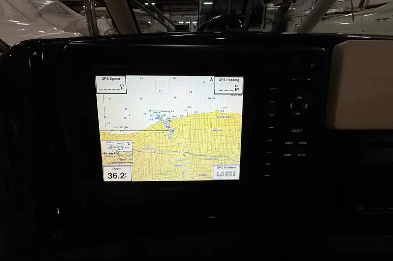 Slide: The Image of Garmin GPS display on 2014 Pursuit DC 265 Dual Console boat, showing map and depth. - 46