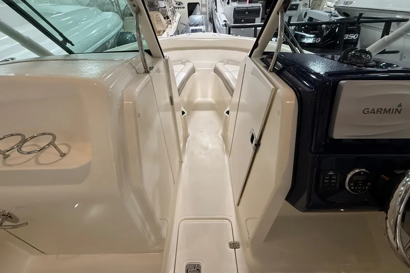 Slide: The Image of 2014 Pursuit DC 265 Dual Console boat interior with Garmin navigation system. - 52