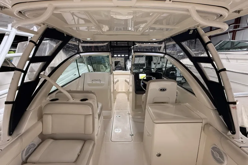 Slide: The Image of 2014 Pursuit DC 265 Dual Console boat in indoor storage facility. - 6