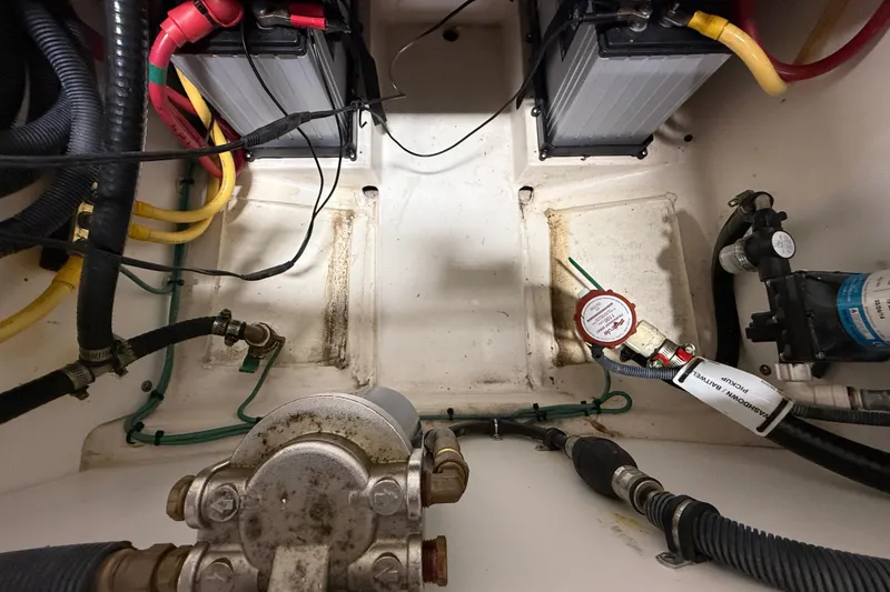 Slide: The Image of Engine compartment of 2014 Pursuit DC 265 Dual Console with batteries and wiring. - 61