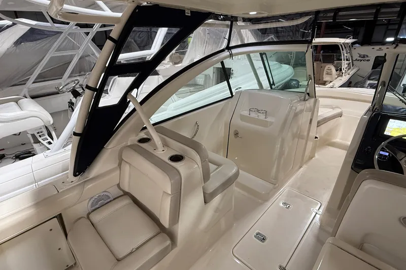 Slide: The Image of 2014 Pursuit DC 265 Dual Console boat with Yamaha 350 V8 engine in storage facility. - 8