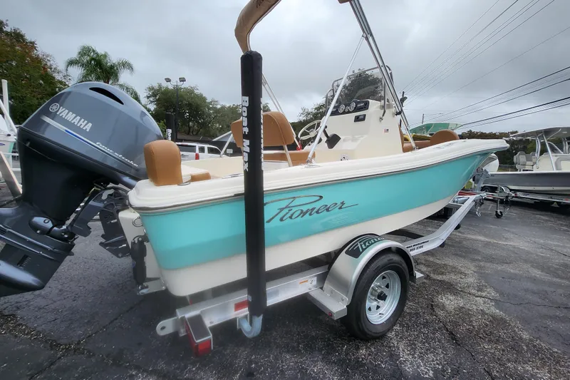 Slide: The Image of 2026 Pioneer 180 Islander boat with Yamaha engine on a trailer. - 1