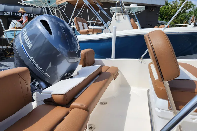 Slide: The Image of 2026 Pioneer 180 Islander boat with Yamaha engine, featuring tan seating and sleek design. - 3