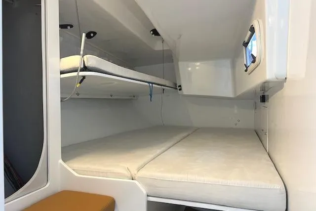 Slide: The Image of Interior cabin of 2024 Neo 43 Romo yacht with bunk beds and window. - 13