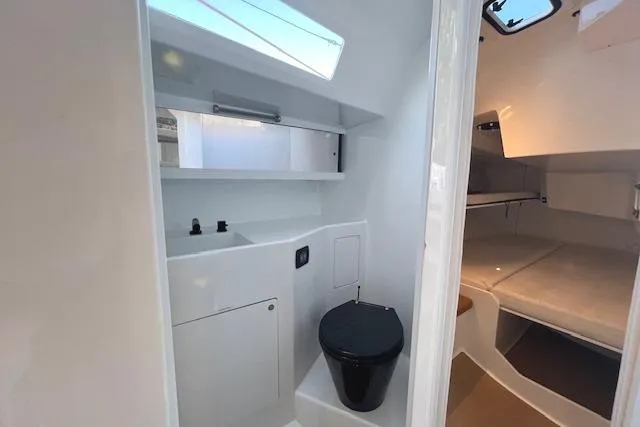 Slide: The Image of Interior of 2024 Neo 43 Romo yacht, featuring compact bathroom and cozy sleeping area. - 18