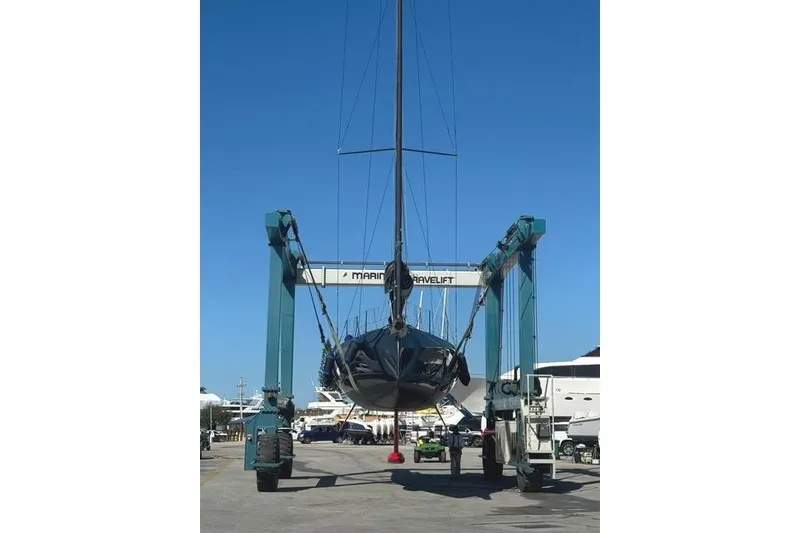 Slide: The Image of 2024 Neo 43 Romo yacht on a travel lift at a marina. - 4