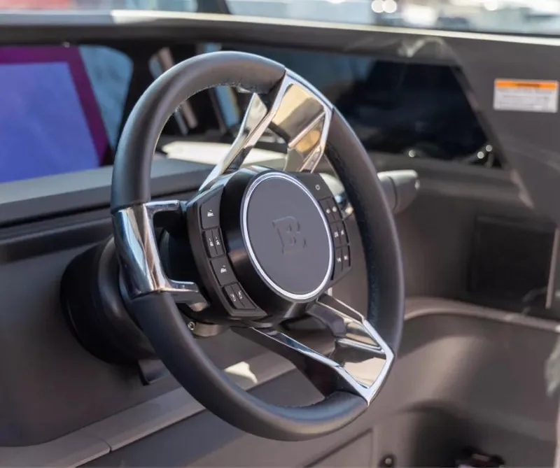 Slide: The Image of Steering wheel of 2025 Axopar 45 Cross Top boat, featuring modern design and controls. - 8