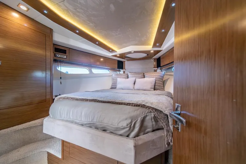 Slide: The Image of Luxurious bedroom interior of 2017 Cruisers Yachts 45 Cantius with modern design and ambient lighting. - 24