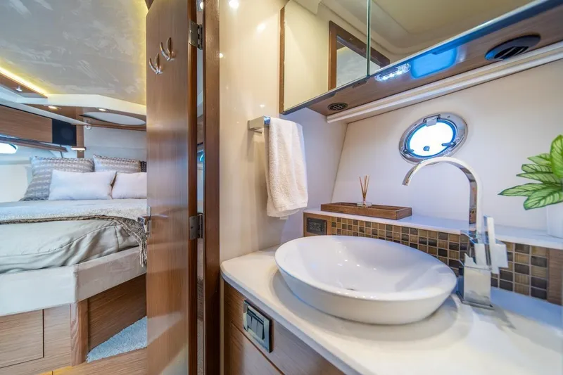 Slide: The Image of Luxurious 2017 Cruisers Yachts 45 Cantius interior with elegant bathroom and cozy bedroom. - 27