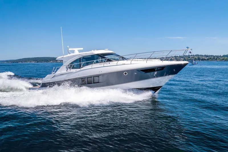 Slide: The Image of 2017 Cruisers Yachts 45 Cantius cruising on open water under clear blue skies. - 3