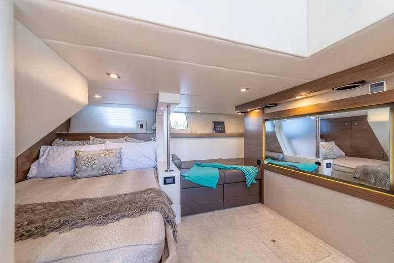 Slide: The Image of Luxurious 2017 Cruisers Yachts 45 Cantius bedroom interior with modern decor and cozy bedding. - 32