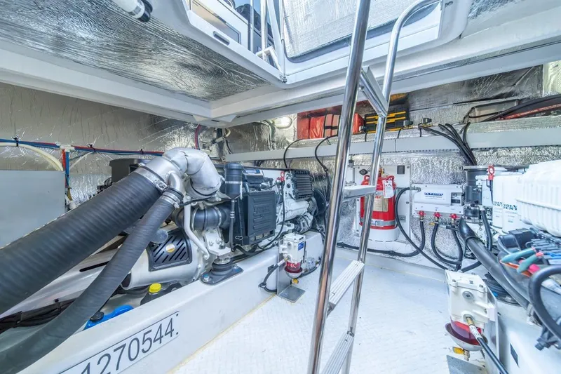 Slide: The Image of Engine room of 2017 Cruisers Yachts 45 Cantius, featuring modern equipment and safety gear. - 40