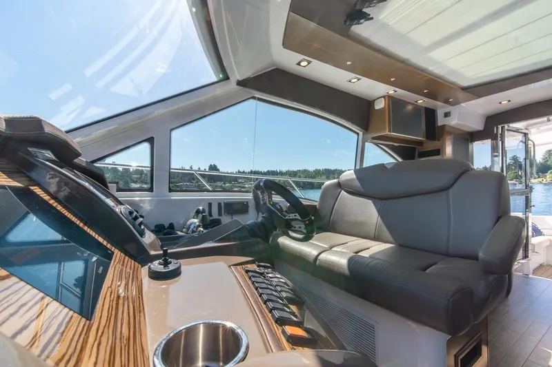 Slide: The Image of Interior of 2017 Cruisers Yachts 45 Cantius, featuring luxurious seating and modern helm. - 21