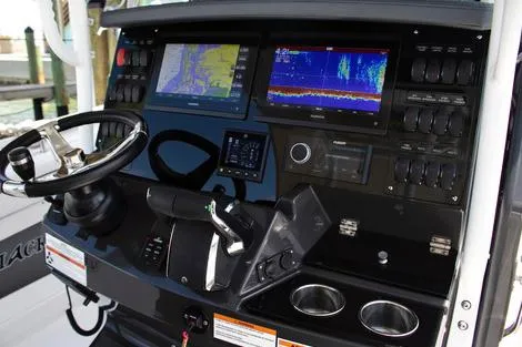 Slide: The Image of Manufacturer Provided Image: 2026 Blackfin 302 CC boat dashboard with advanced navigation and control systems. - 4