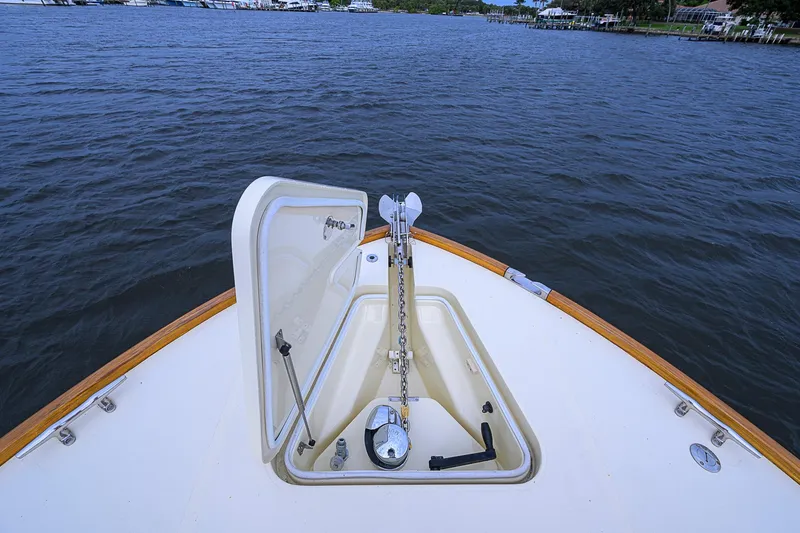 Slide: The Image of Bow of 2006 Hinckley Talaria 40 yacht with open anchor hatch on calm water. - 23
