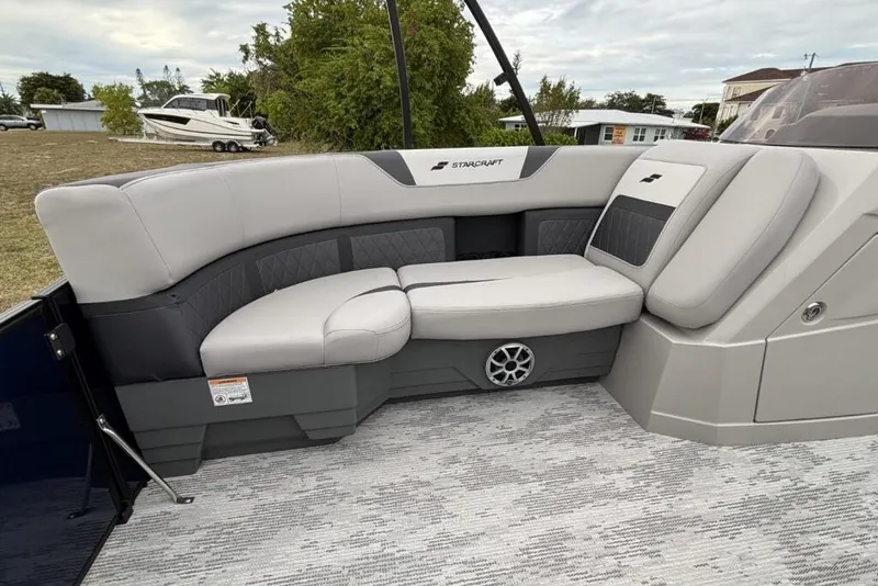 Slide: The Image of 2026 Starcraft SLS 3DL DH BAR boat interior with plush seating and modern design. - 12
