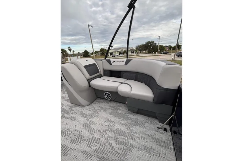 Slide: The Image of 2026 Starcraft SLS 3DL DH BAR boat interior with gray seating and modern design. - 14