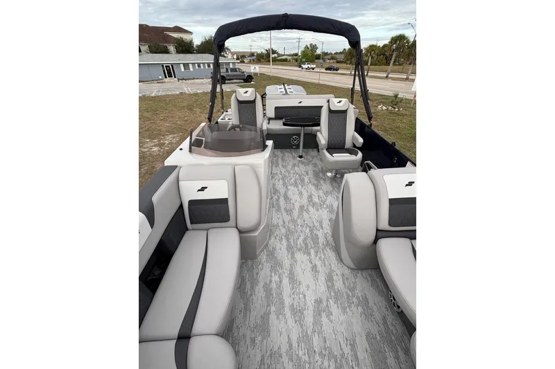 Slide: The Image of 2026 Starcraft SLS 3DL DH BAR pontoon boat interior with modern seating and flooring. - 15