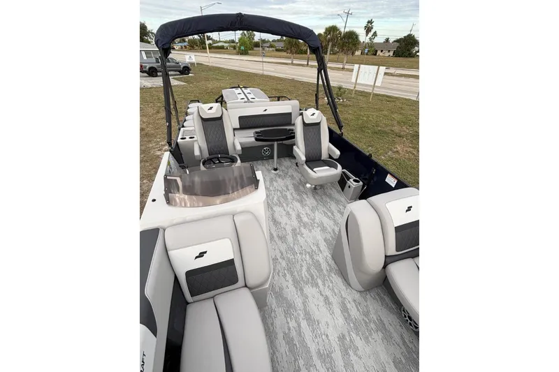 Slide: The Image of 2026 Starcraft SLS 3DL DH BAR boat interior with modern seating and sleek design. - 16