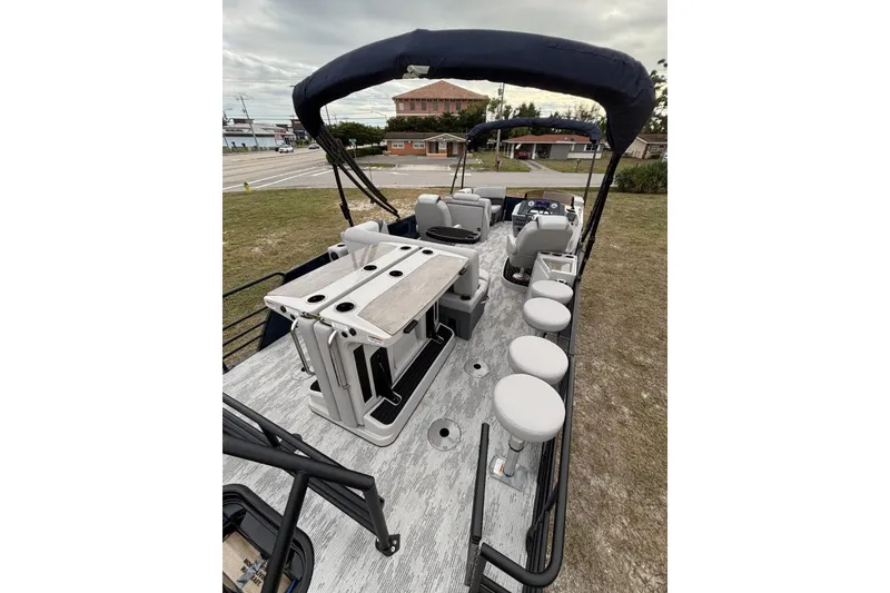 Slide: The Image of 2026 Starcraft SLS 3DL DH BAR pontoon boat with seating and bar setup. - 8