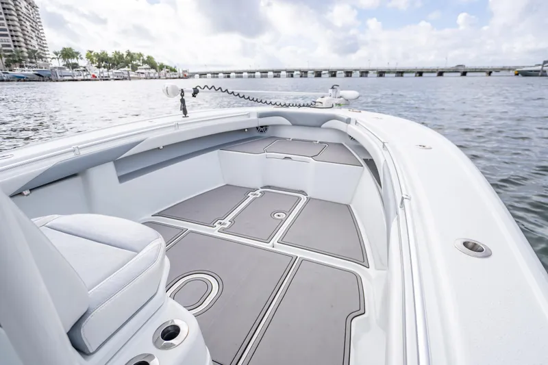Slide: The Image of 2021 Yellowfin 26 Hybrid boat interior with sleek design on calm water. - 21
