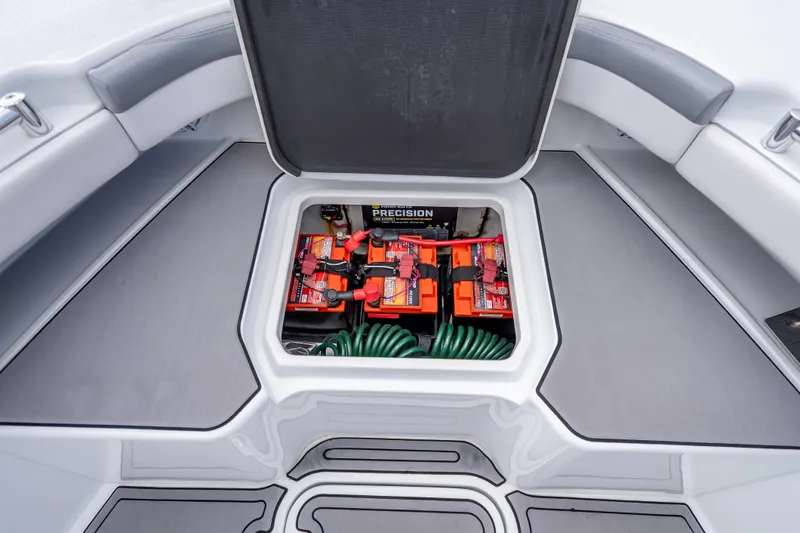 Slide: The Image of 2021 Yellowfin 26 Hybrid boat storage compartment with batteries and equipment. - 23