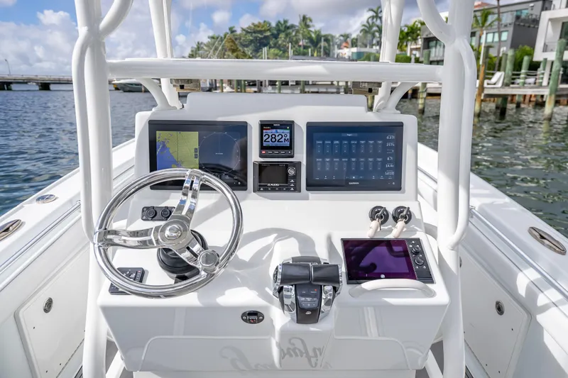 Slide: The Image of 2021 Yellowfin 26 Hybrid boat dashboard with advanced navigation and control systems. - 31